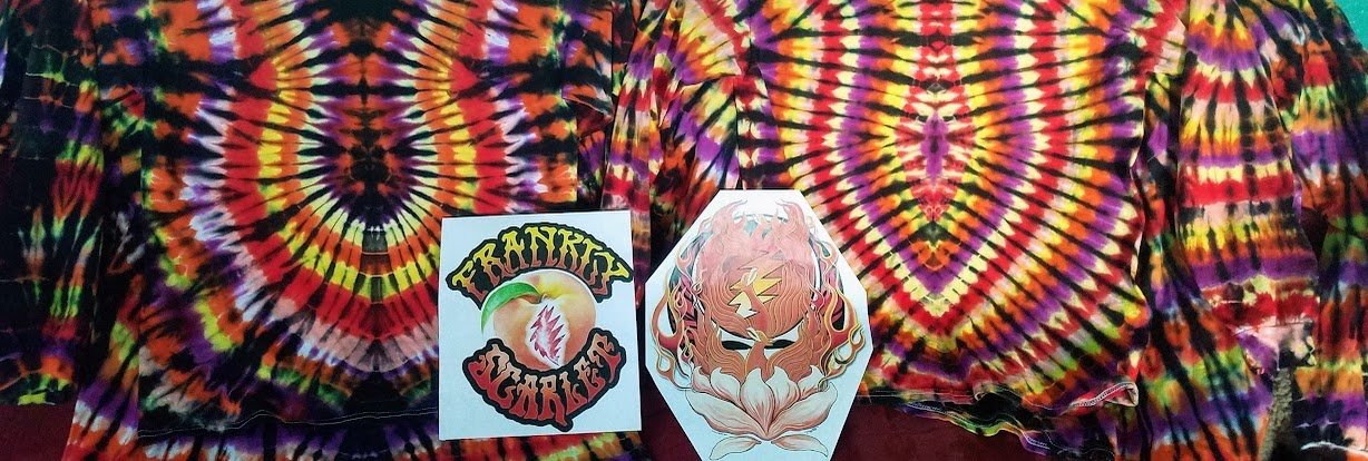 Tie-dye shirts with band artwork displayed on top